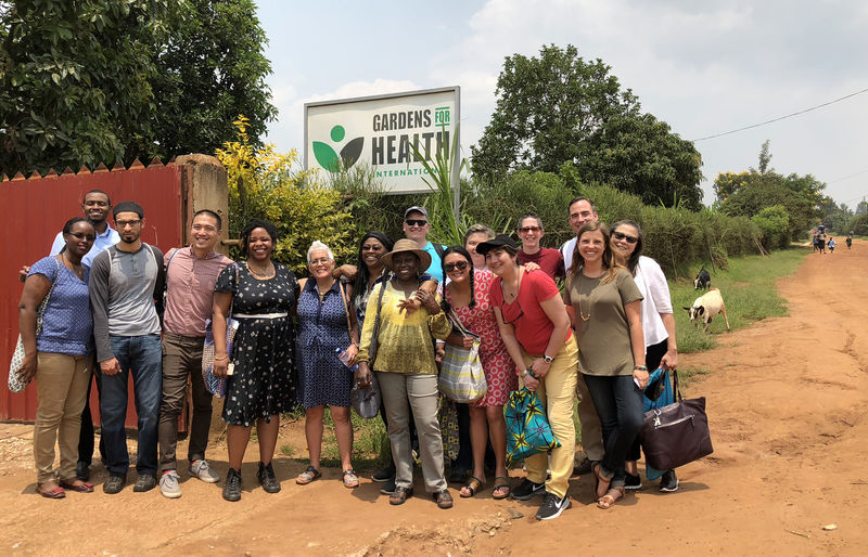 Photo of group in front of NGO in Rwanda