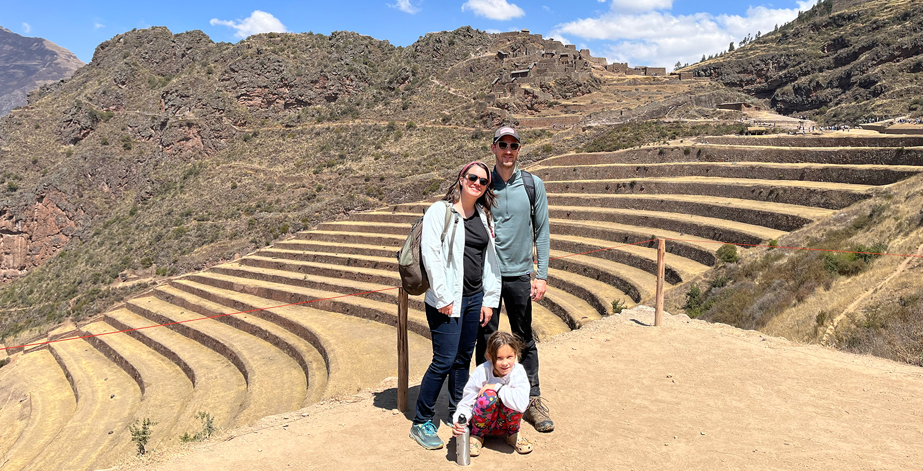 A family overlooks Machu Picchu in Peru.
