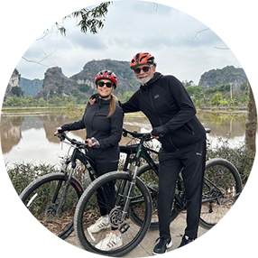 A couple riding bicycles in Vietnam.