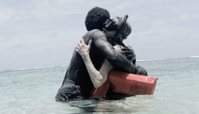 Mom hugging guide after snorkeling for the first time in Belize.