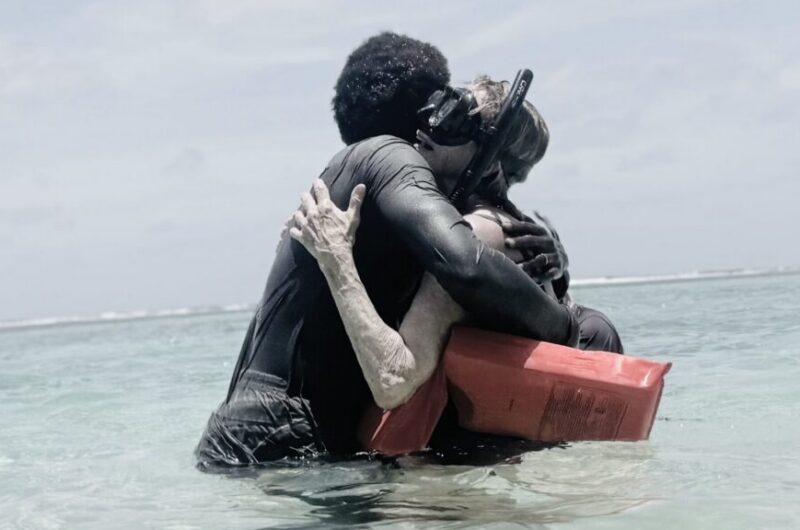 Mom hugging guide after snorkeling for the first time in Belize.